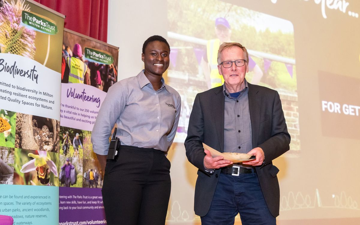 Parks Trust staff member presenting award to Roy