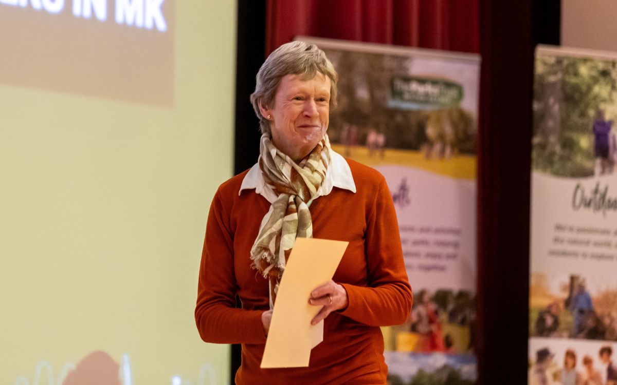 Person collecting award on stage