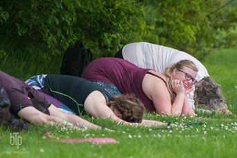 Yoga in the park action shot.