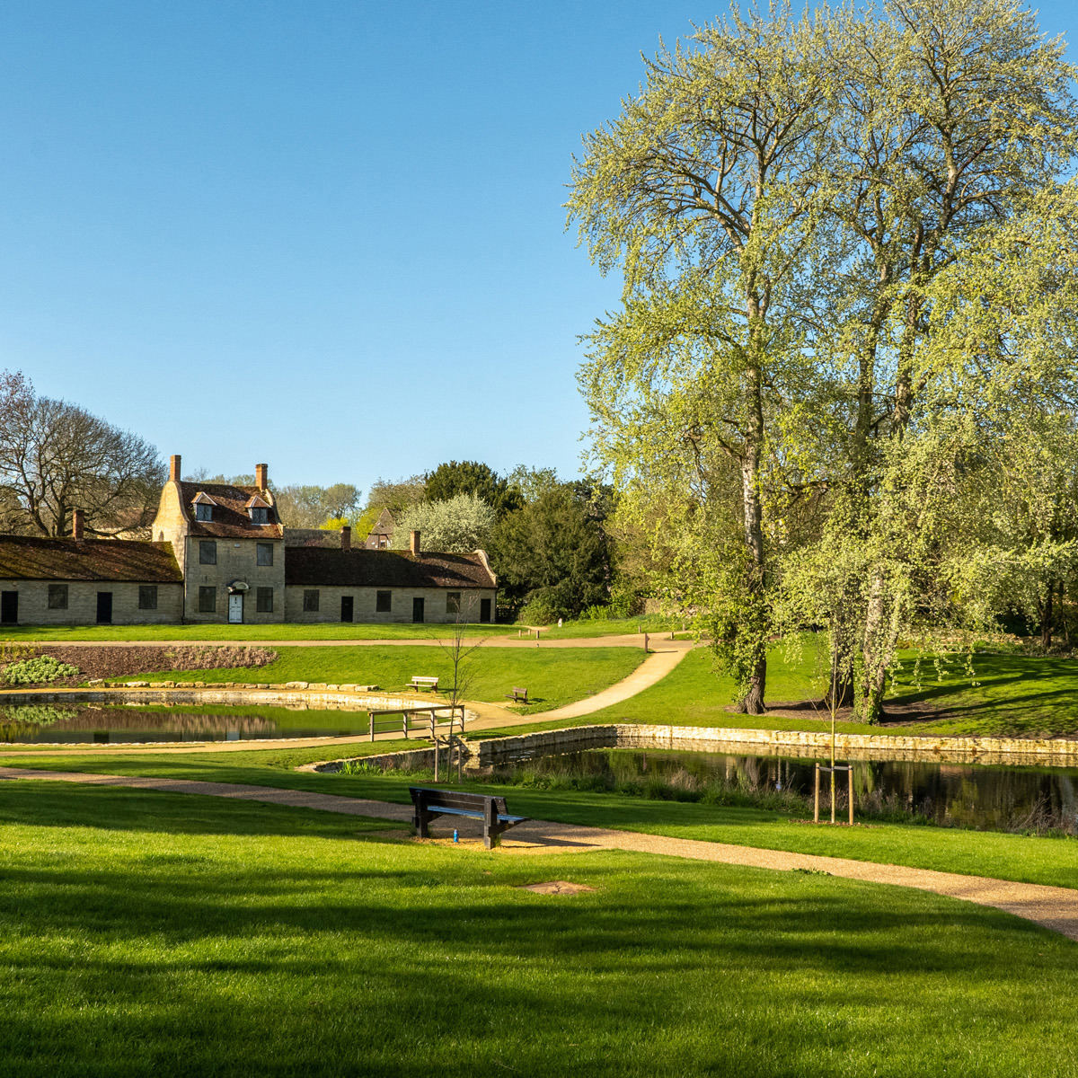 Stone building and ornamental lakes at Great Linford Manor Park.