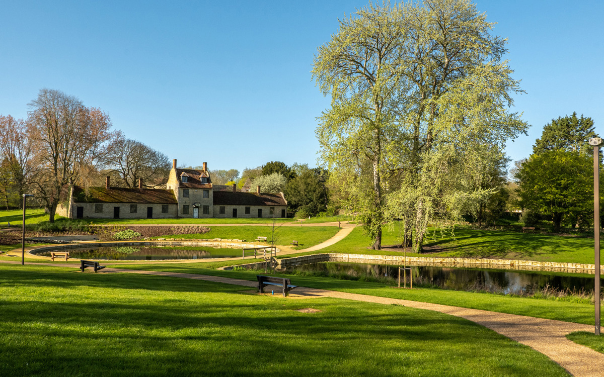 Stone building and ornamental lakes at Great Linford Manor Park.