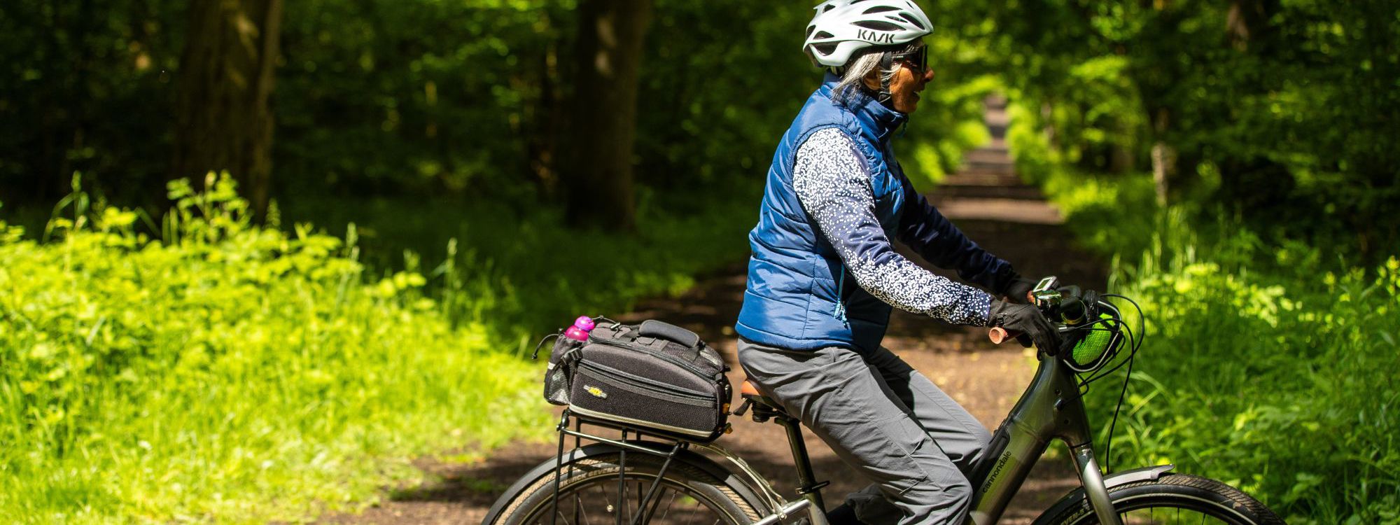 Person cycling in Milton Keynes park