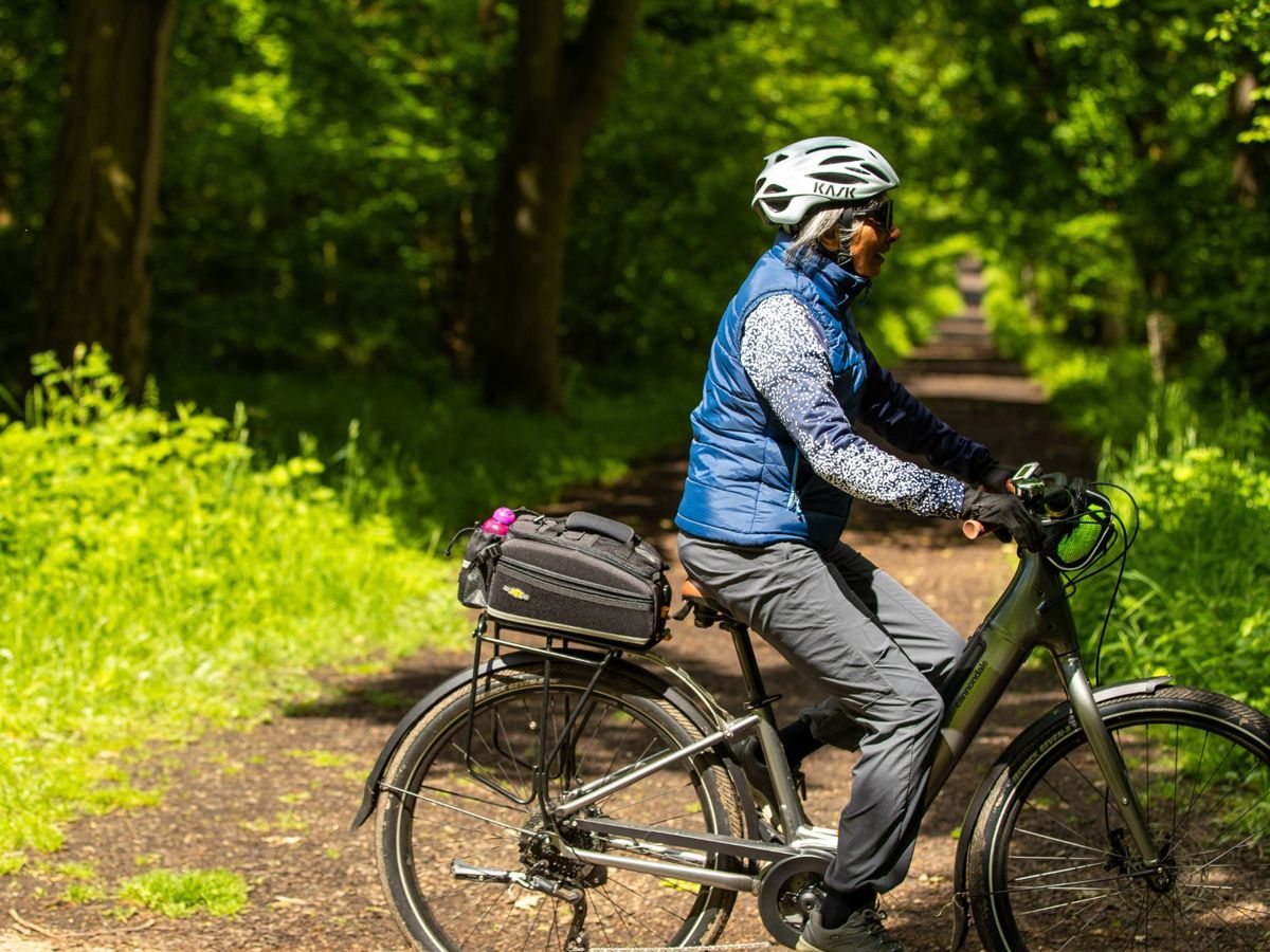 Person cycling in Milton Keynes park
