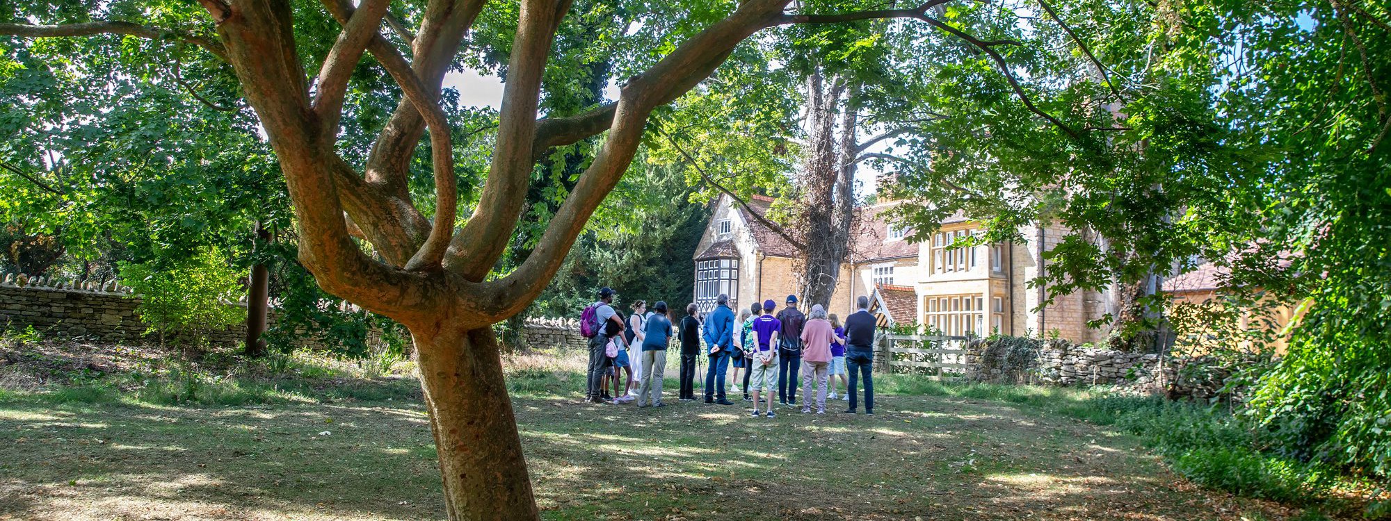 Public gathered on a guided walk at Great Linford Manor 