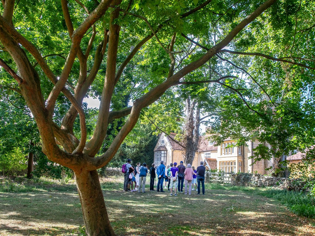 Public gathered on a guided walk at Great Linford Manor 