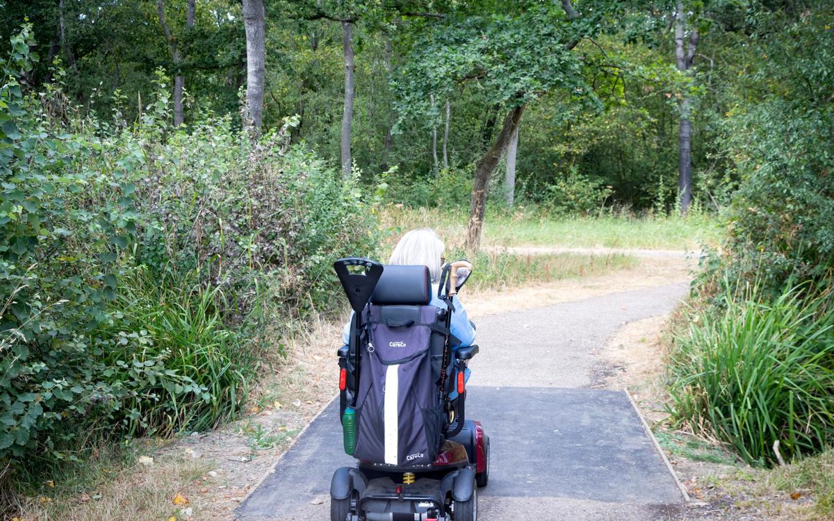 Motorised wheelchair going over newly laid path