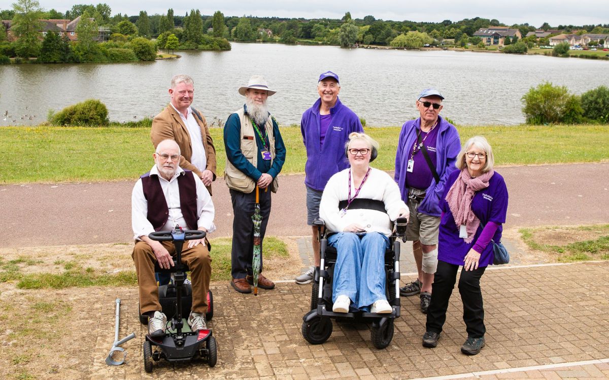 Group of The Parks Trust Access Ambassadors stood in front of Furzton Lake