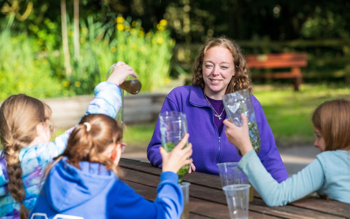 Youth Explorers host and participants taking part in activity