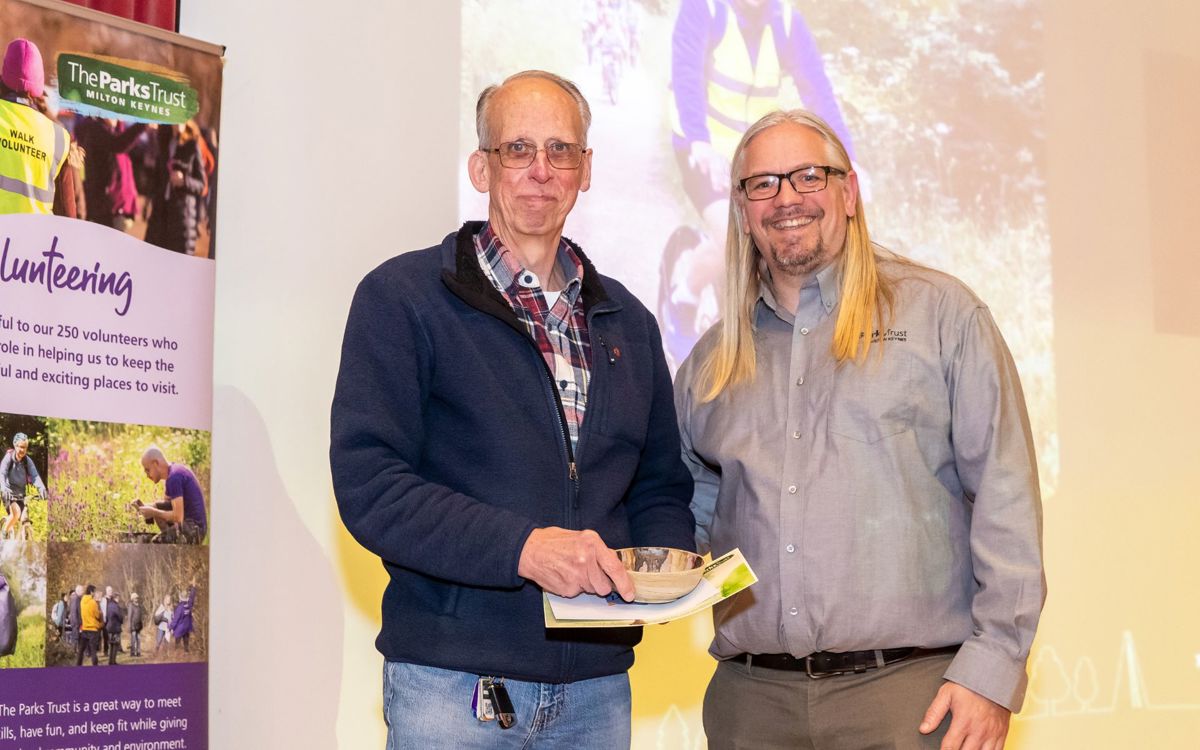 Parks Trust staff member presenting award to Peter
