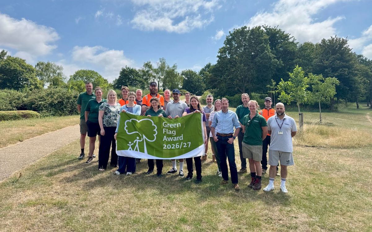 Group photo of Parks Trust staff holding Green Flag