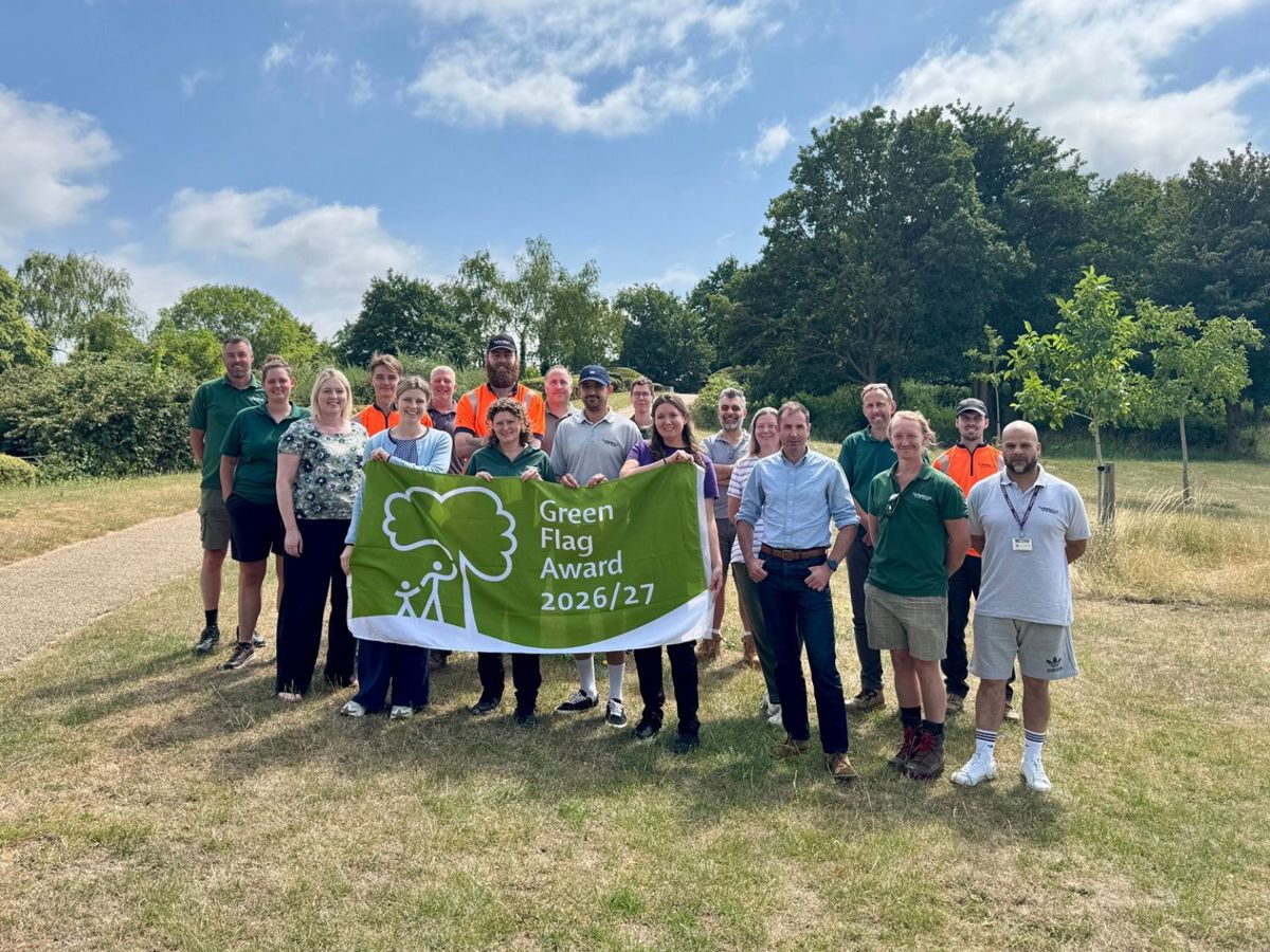 Group photo of Parks Trust staff holding Green Flag