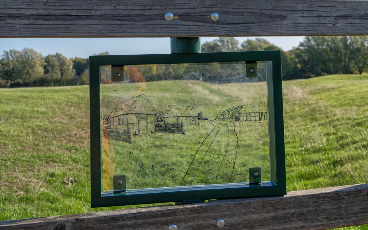 Viewing glass with village outline and park behind