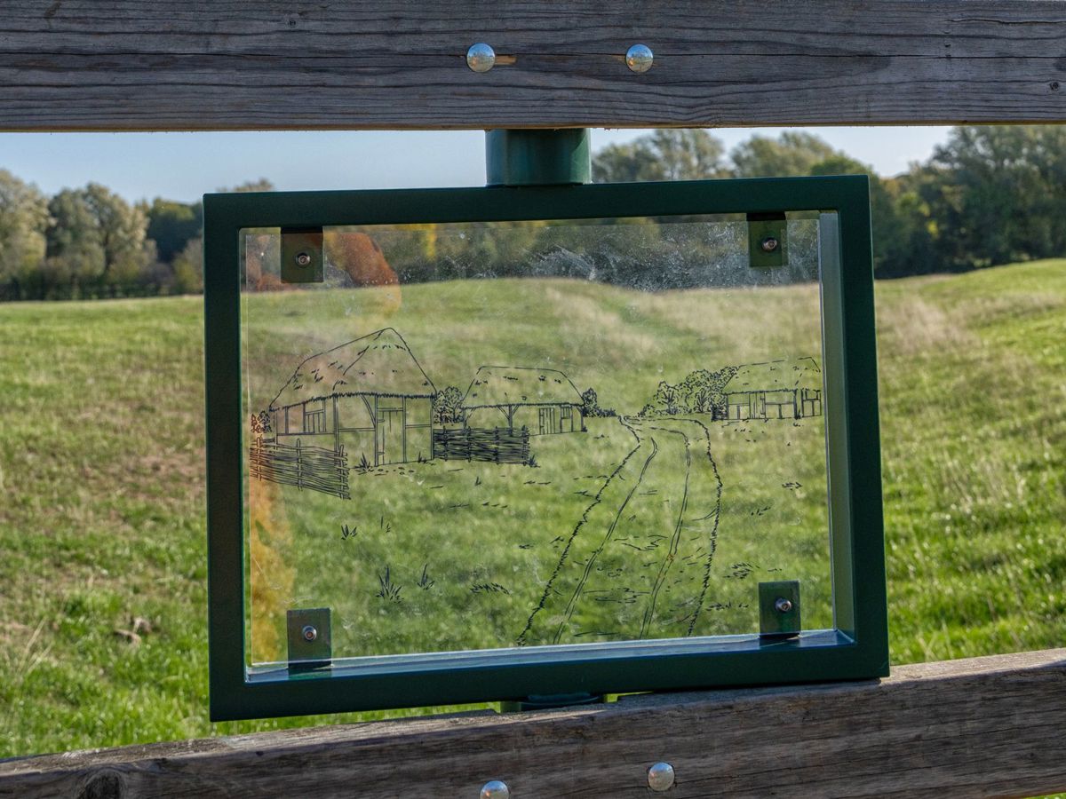 Viewing glass with village outline and park behind