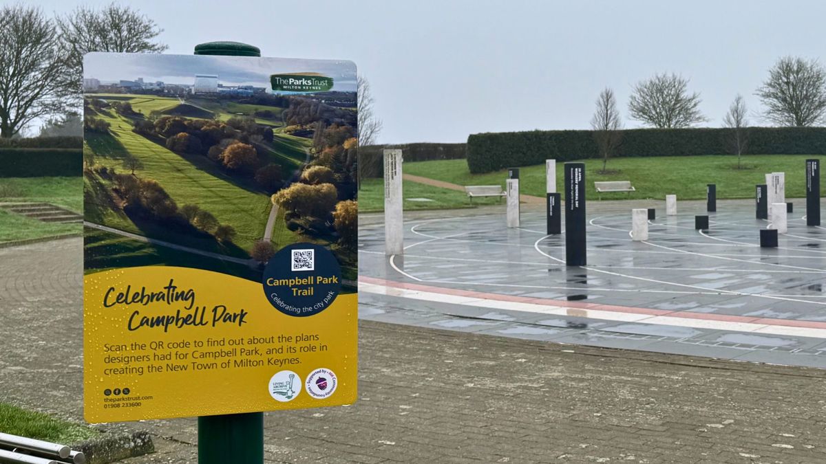 Campbell Park trail sign infront of the Milton Keynes Rose sculpture