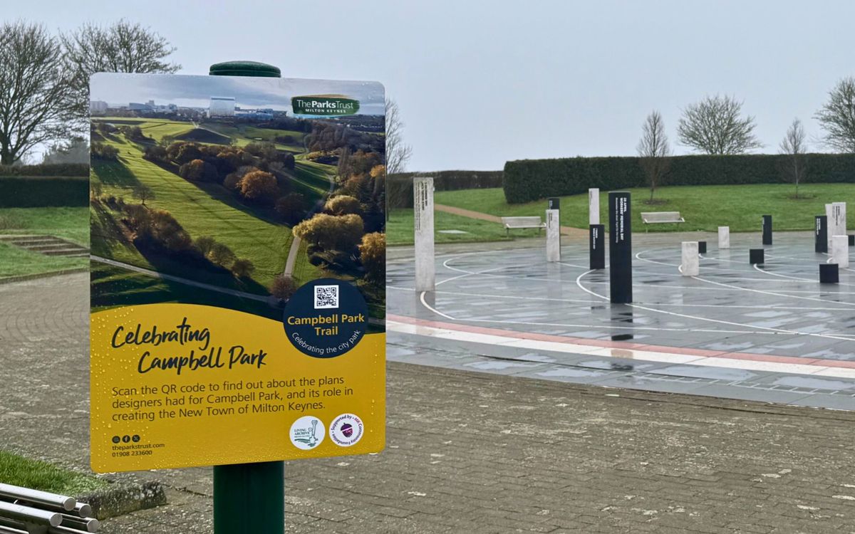 Campbell Park trail sign infront of the Milton Keynes Rose sculpture