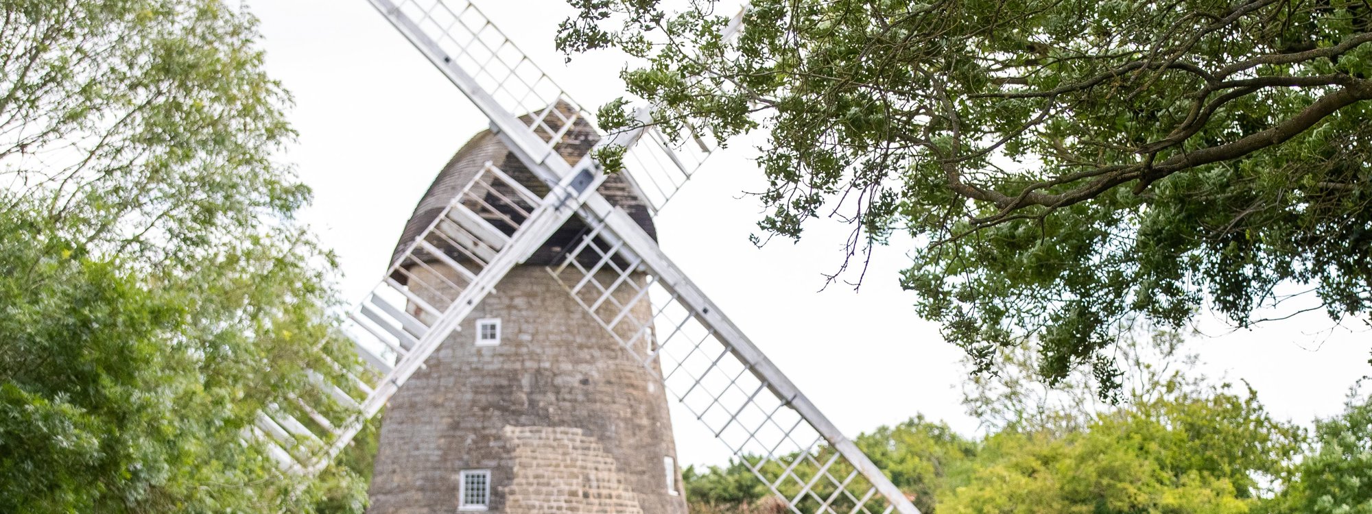 Bradwell Windmill with walkers in the foreground