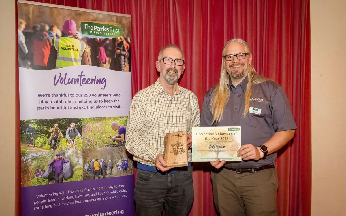 Bob and David holding award and trophy
