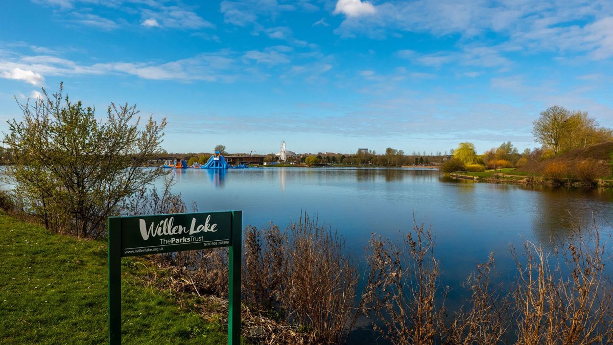 Willen Lake signage with the lake in the background