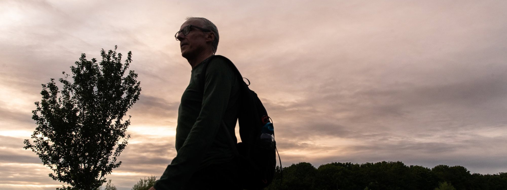 A person walking at dusk