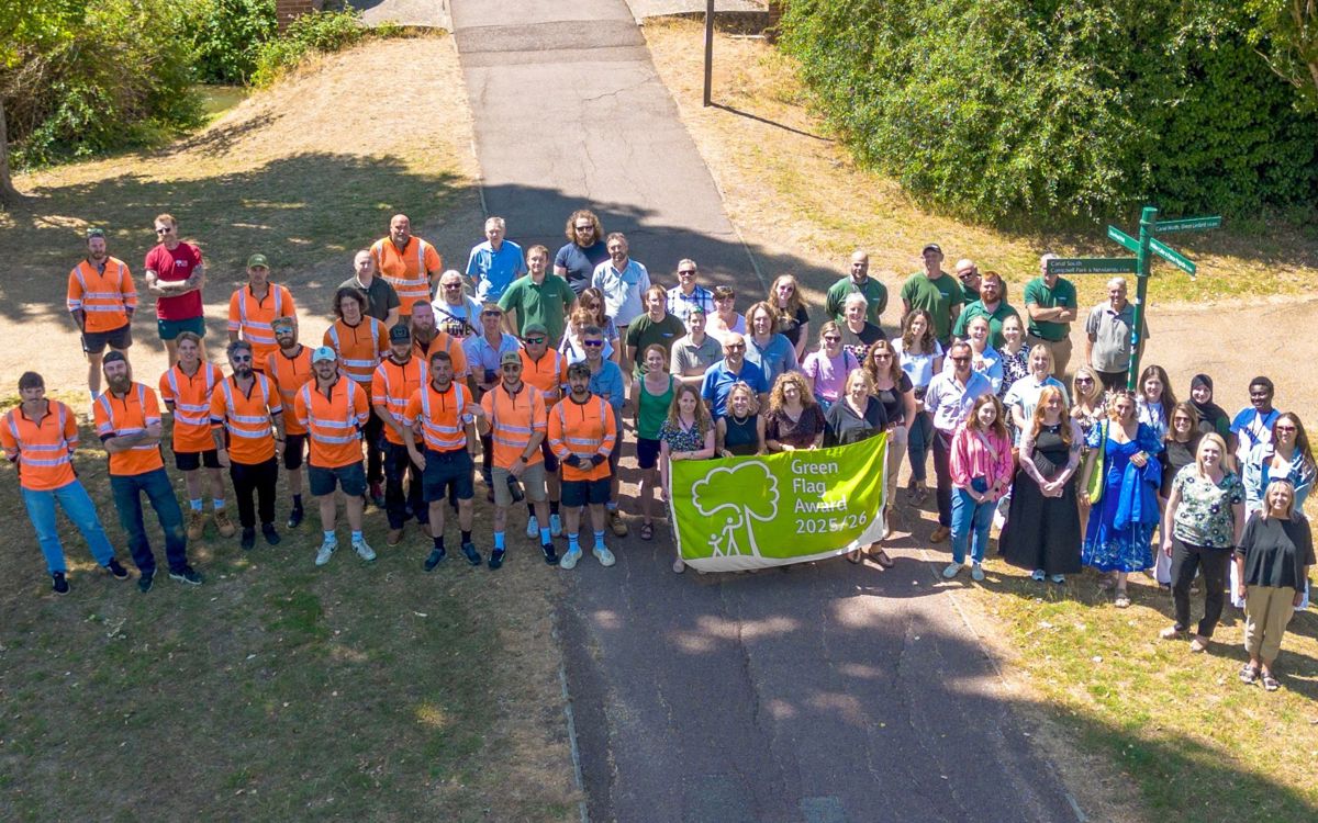 Group of Parks Trust staff with Green Flag Award banner
