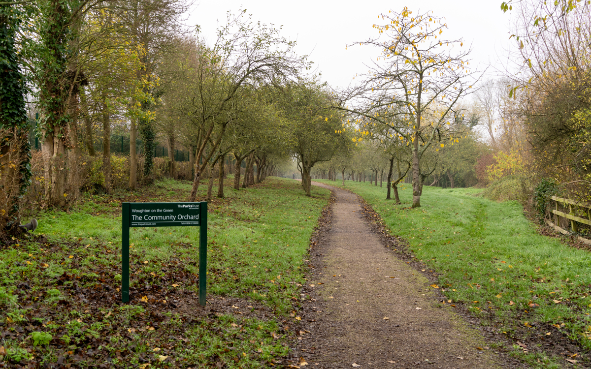 Woughton on the Orchard sign with path in winter