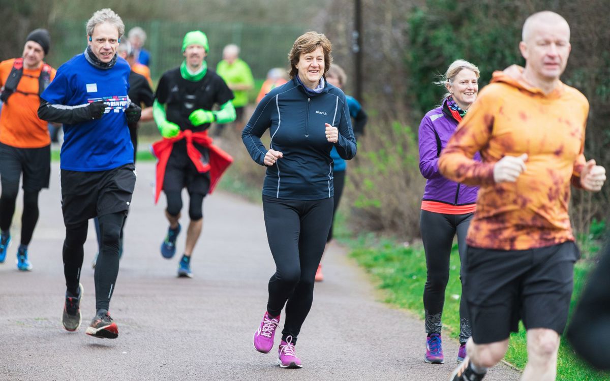 Group of people running in park at an event in Milton Keynes