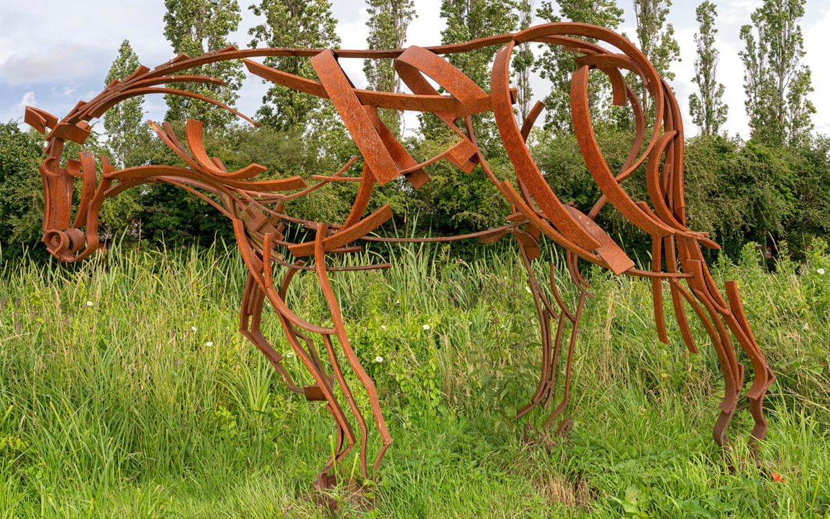 Red metal shire horse sculpture at Canal Broadwalk.