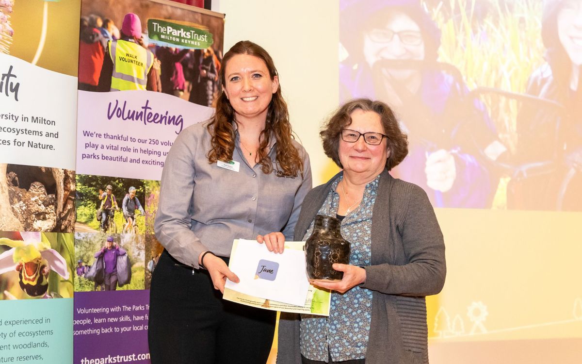 Outdoor Learning leader presenting award to Jane