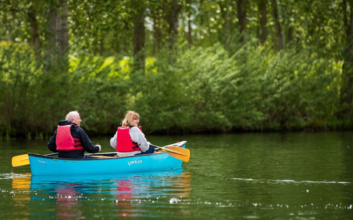 Two people canoeing on lake in Milton Keynes