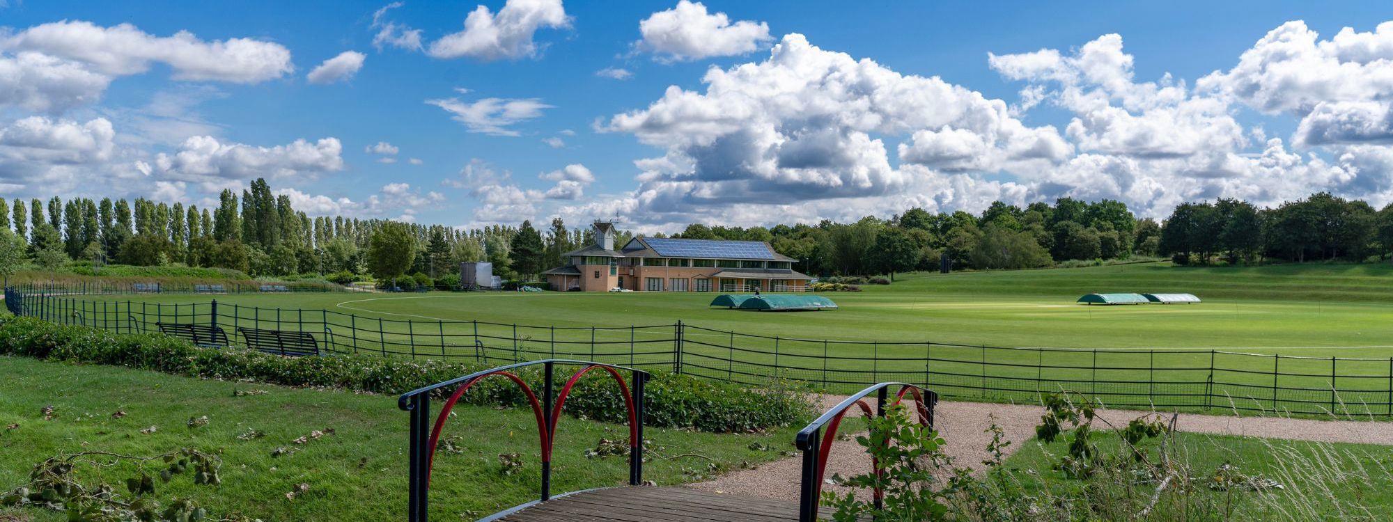Campbell Park Office With Bridge And Cricket Pitch