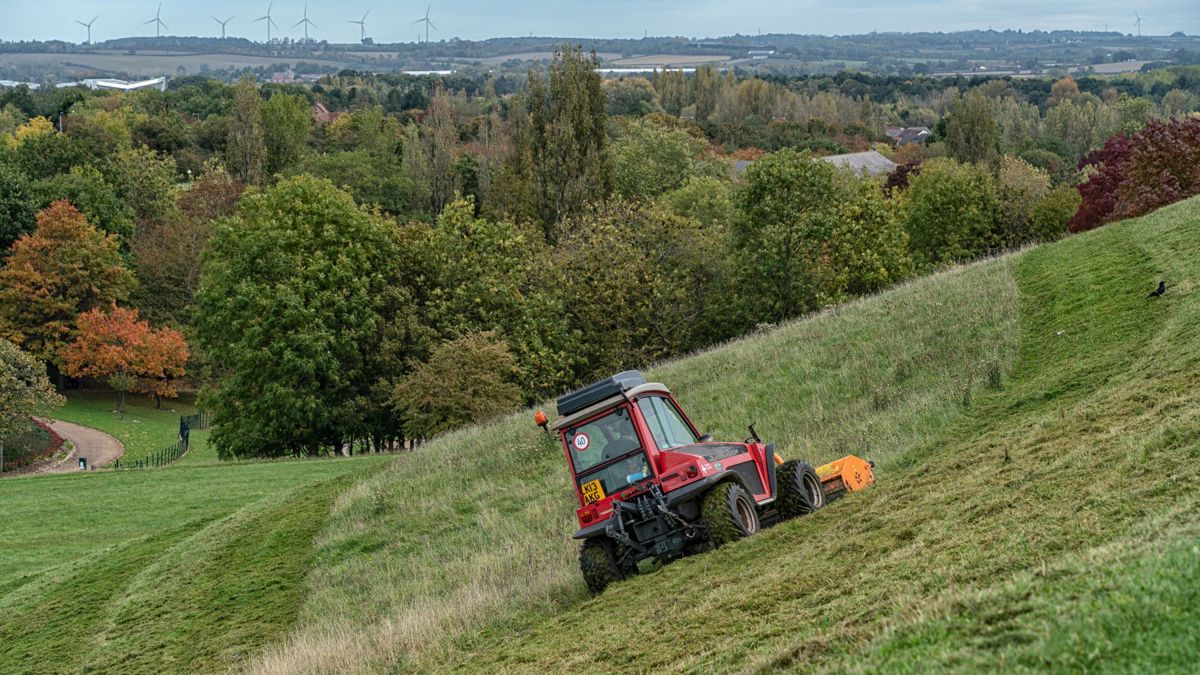 Contractor carrying out grass cutting work in Campbell Park Milton Keynes