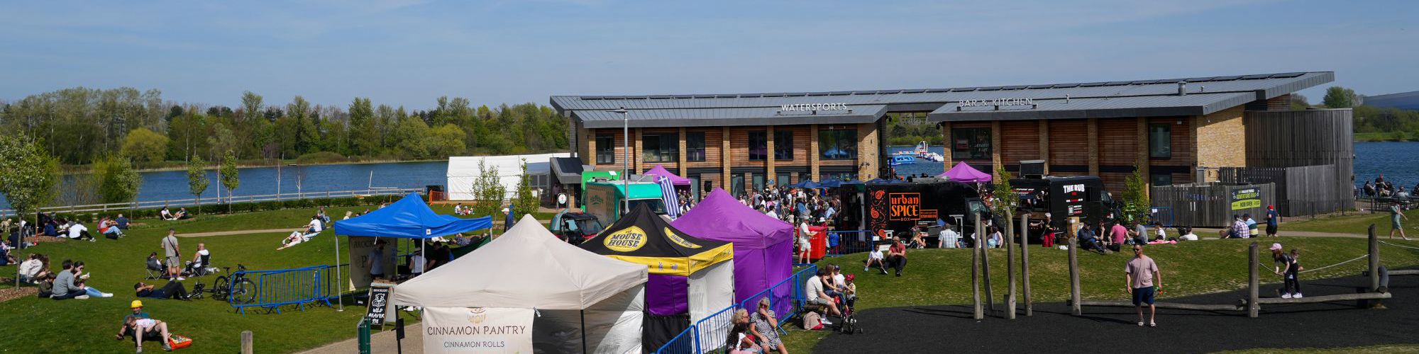Food event with stalls taking place in front of watersports centre