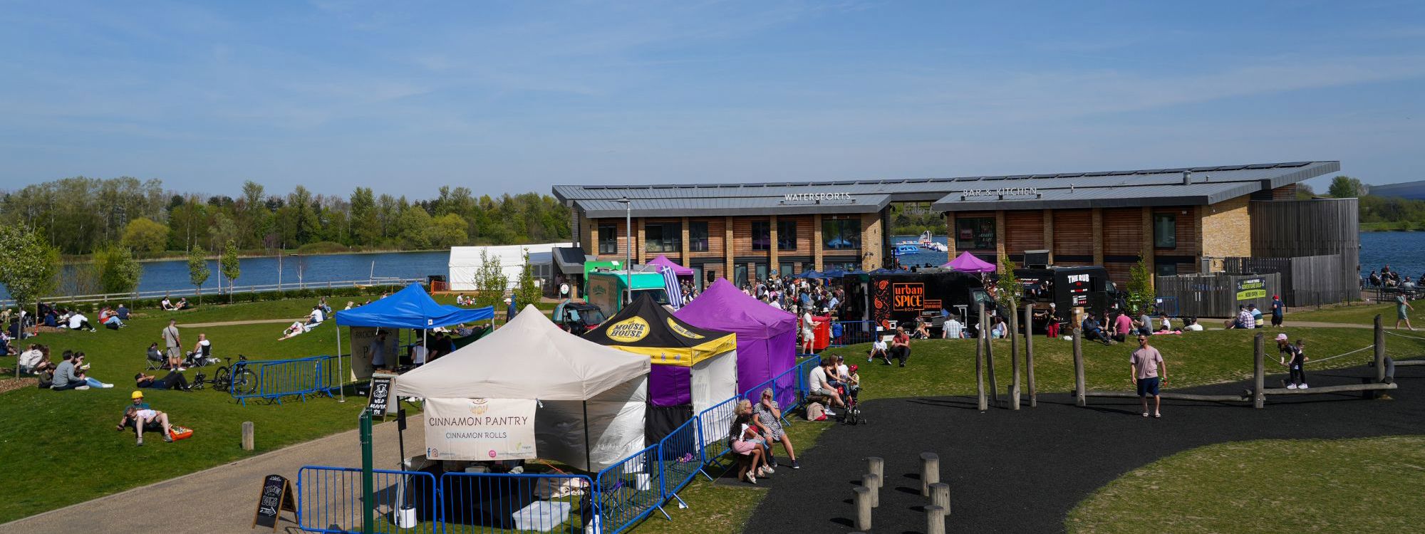 Food event with stalls taking place in front of watersports centre