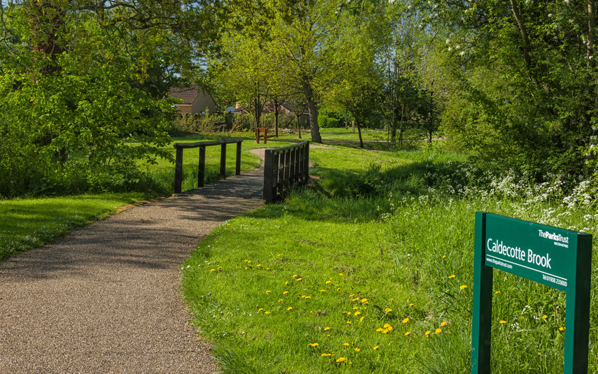 Footbridge at Caldecotte Brook park.
