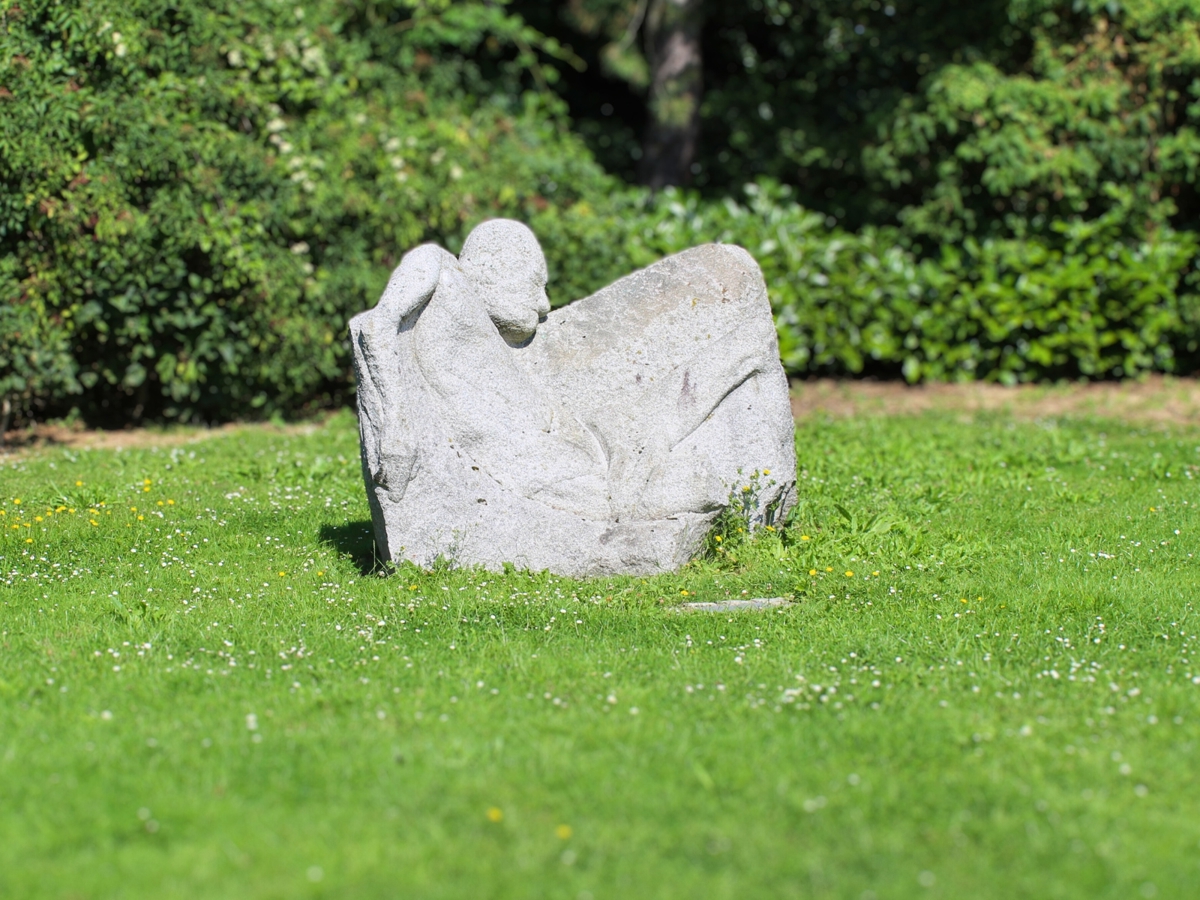a large stone with a person carved into it