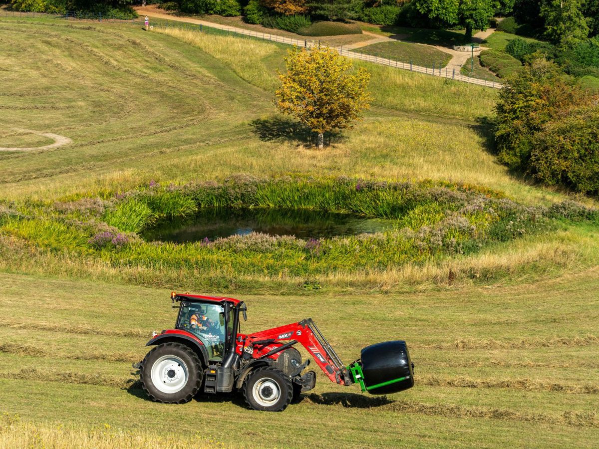 Tractor moving hay in Campbell Park