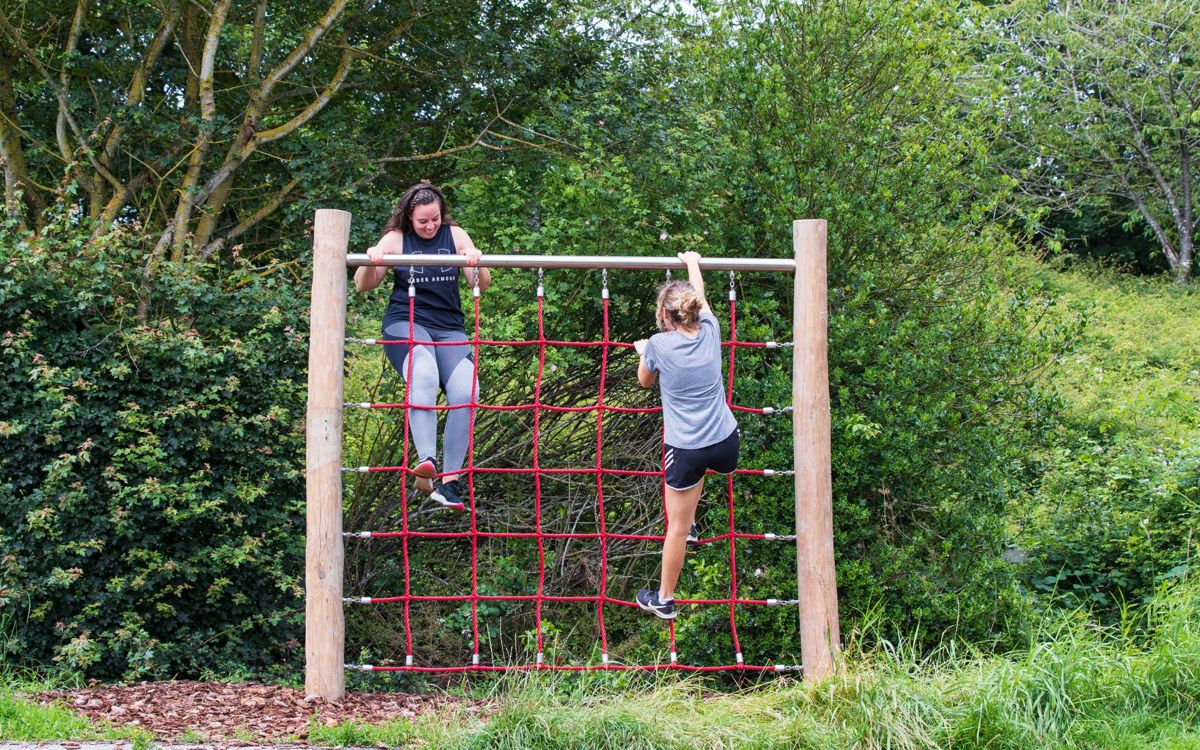 People using trim trail equipment at Lodge Lake
