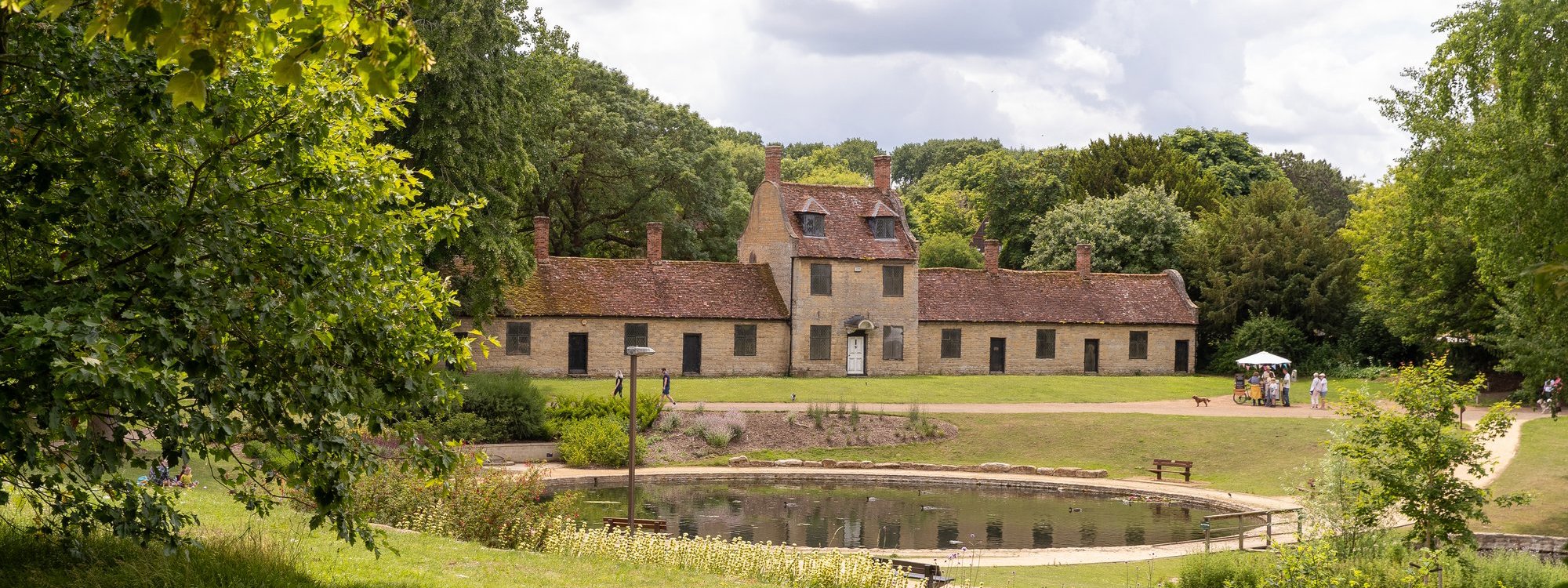 view of the Alms houses at the Great Linford Manor Park on a sunny day 