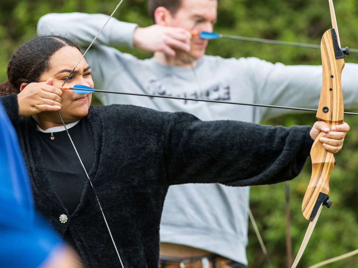 People taking part in an archery session at Willen Lake