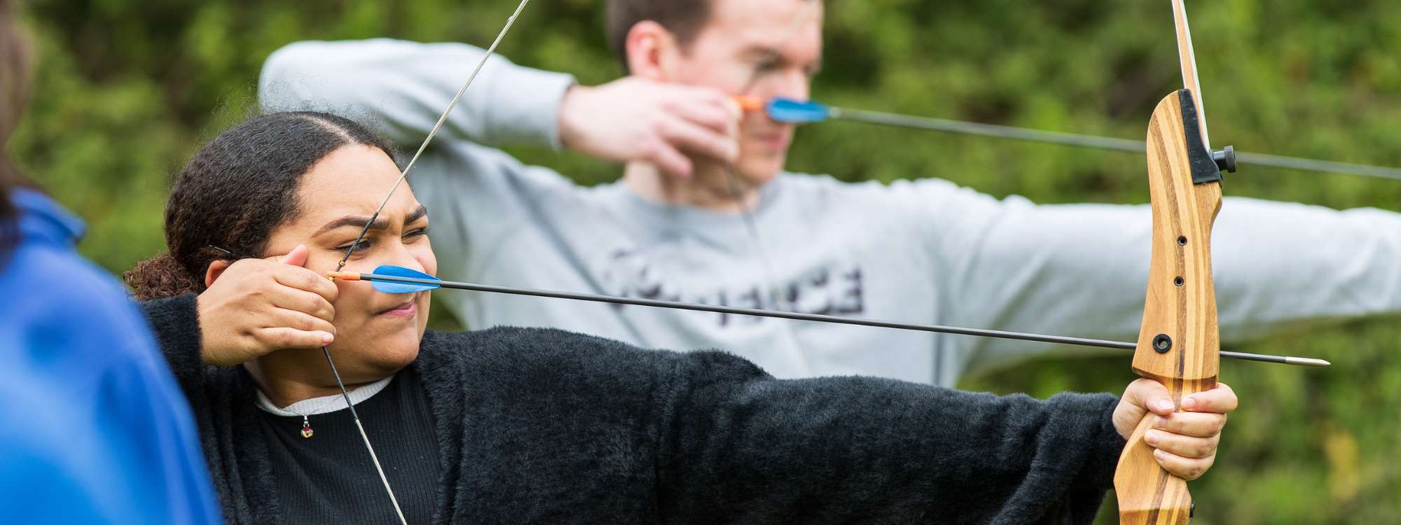 People taking part in an archery session at Willen Lake