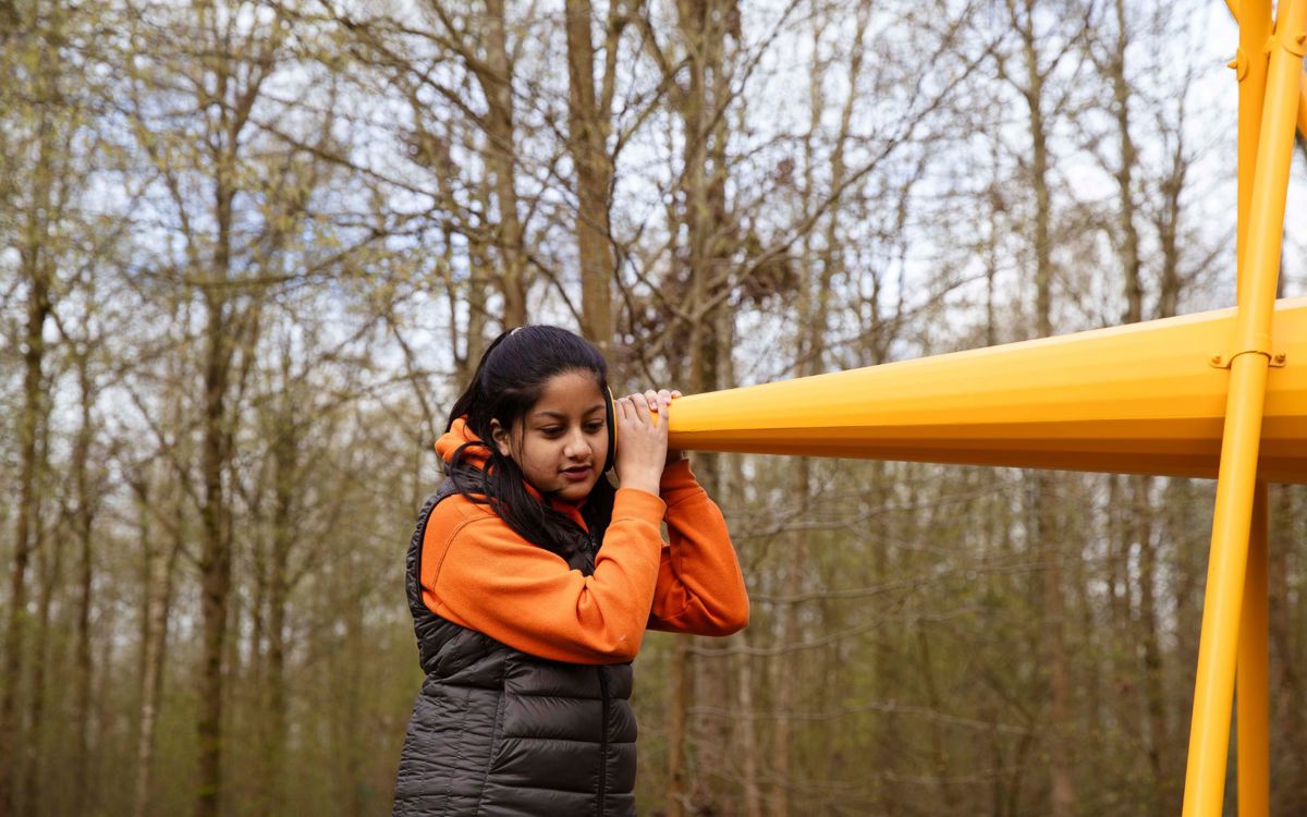 Student listening through steel cone