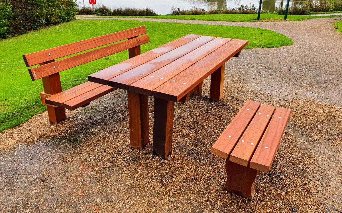 Wooden picnic bench with space for wheelchair or pushchair at Furzton Lake