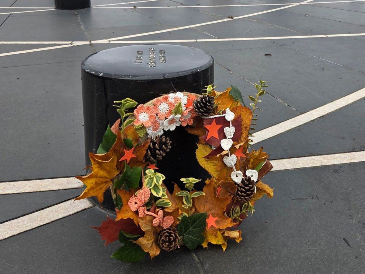 Orange And White Ribbon hand made wreath on Parks Trust pillar, at MK Rose