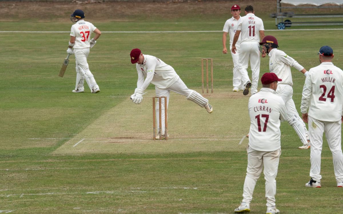 People playing cricket in Campbell Park