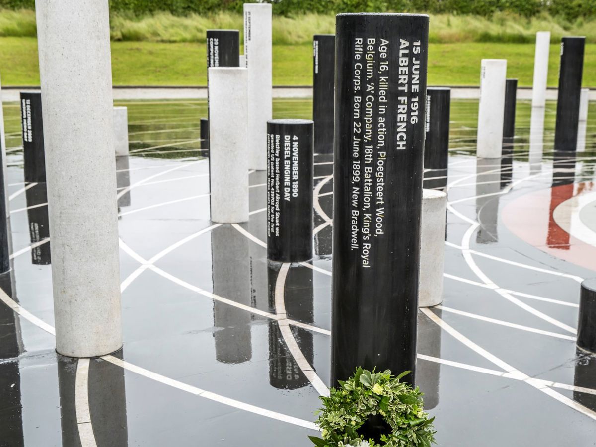 Black pillar inscribed with tribute to Albert French Day at the Milton Keynes Rose