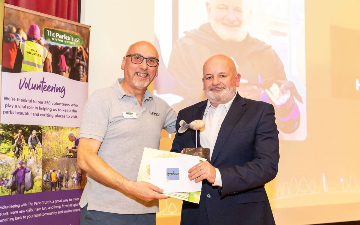 Parks Trust staff presenting award to Graham