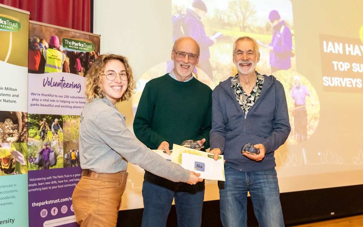 Parks Trust staff member presenting biodiversity award