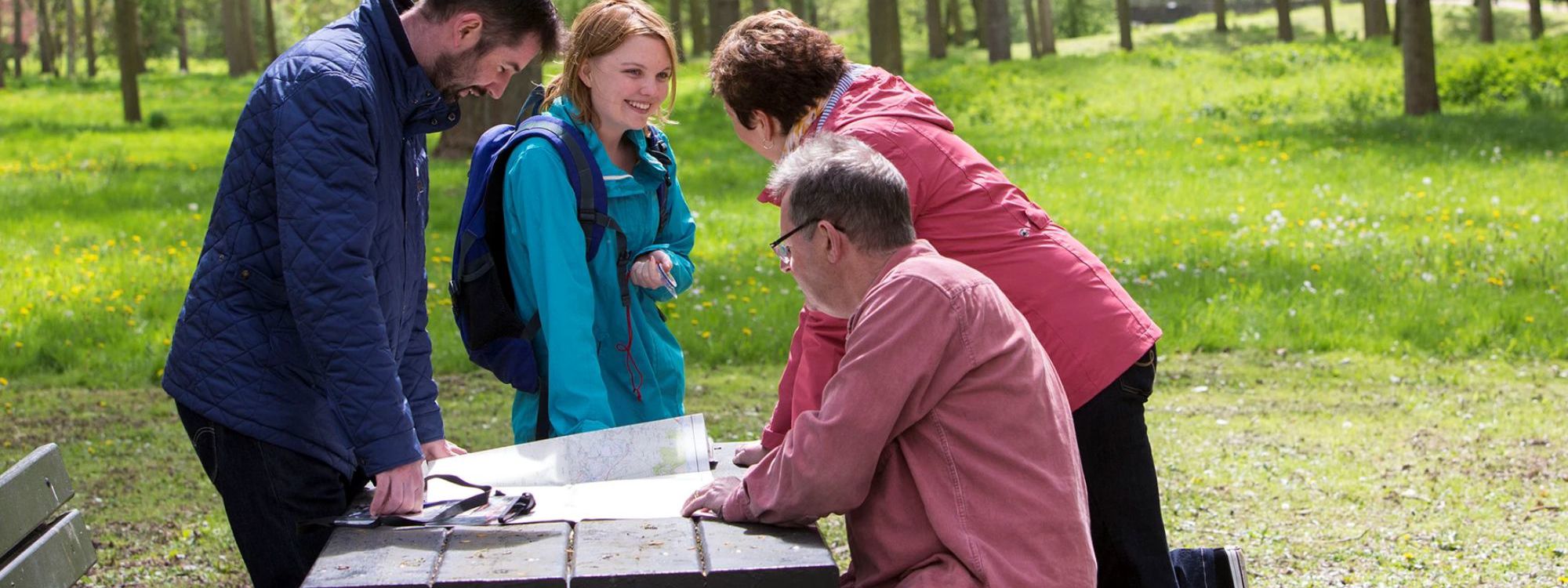 Group of people orienteering in Poplar Plantation