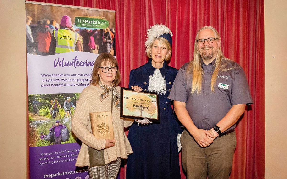 Dawn, the High Sheriff of Buckinghamshire and David stood holding award for Volunteer of the Year