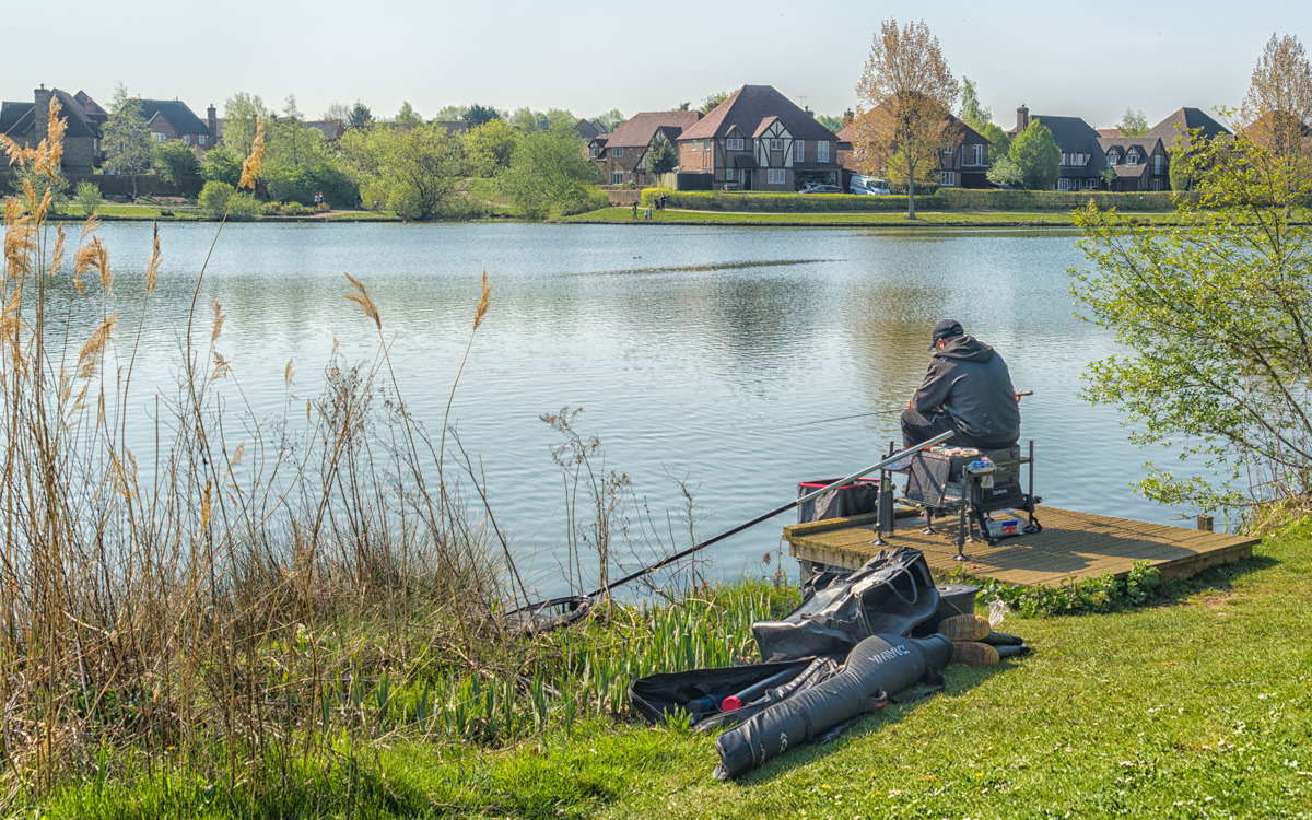 Person fishing at Furzton Lake.